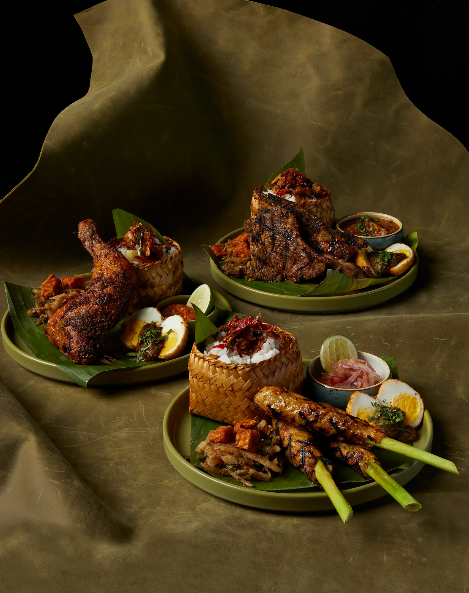 Balinese sharing table spread with rice, satay and sambal