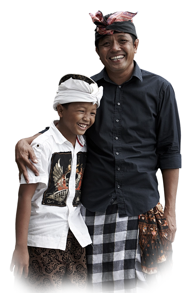 Balinese family in traditional white ceremonial attire