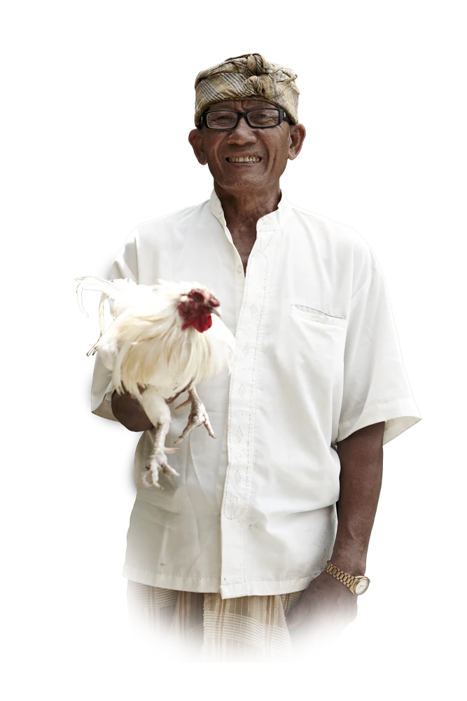 Balinese elder holding a ceremonial offering